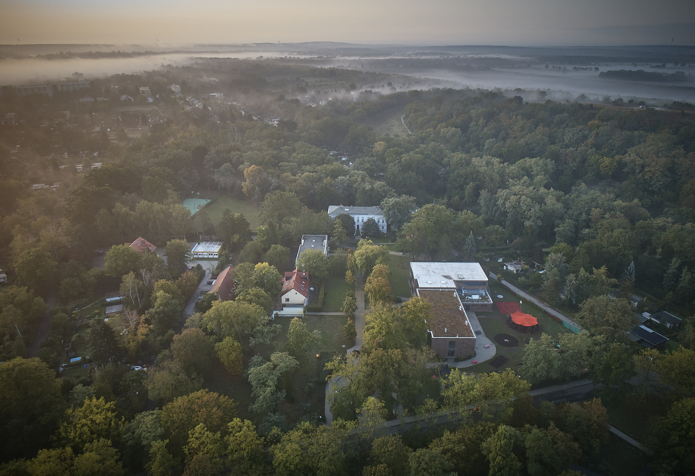 Aerial view of the school grounds at dawn